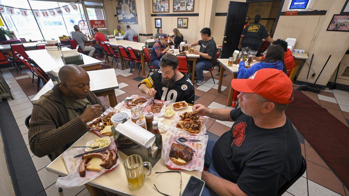 Patrons dine inside Arthur Bryant’s, a longtime Kansas City barbecue restaurant that Miller has owned for the past two years.