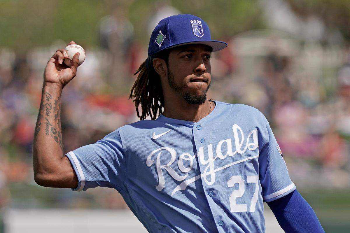 Royals shortstop Adalberto Mondesi throws during the second inning of a spring training game against the Arizona Diamondbacks in Surprise, Ariz.