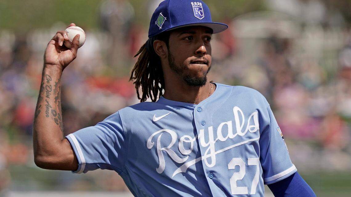 Kansas City Royals shortstop Adalberto Mondesi throws during the second inning of a spring training baseball game against the Arizona Diamondbacks Sunday, March 20, 2022, in Surprise, Ariz. (AP Photo/Charlie Riedel)
