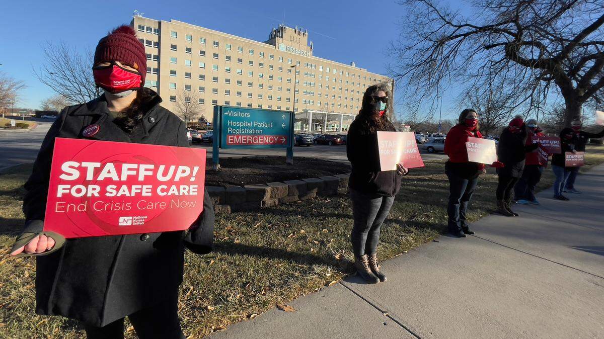 Nurses from Research Medical Center and its sister hospital, the Menorah Medical Center in Overland Park, rallied outside the hospital in Kansas City Thursday morning demanding that the hospitals’ owner, HCA Midwest Health, increase staffing and provided nurses the protections they need at work.