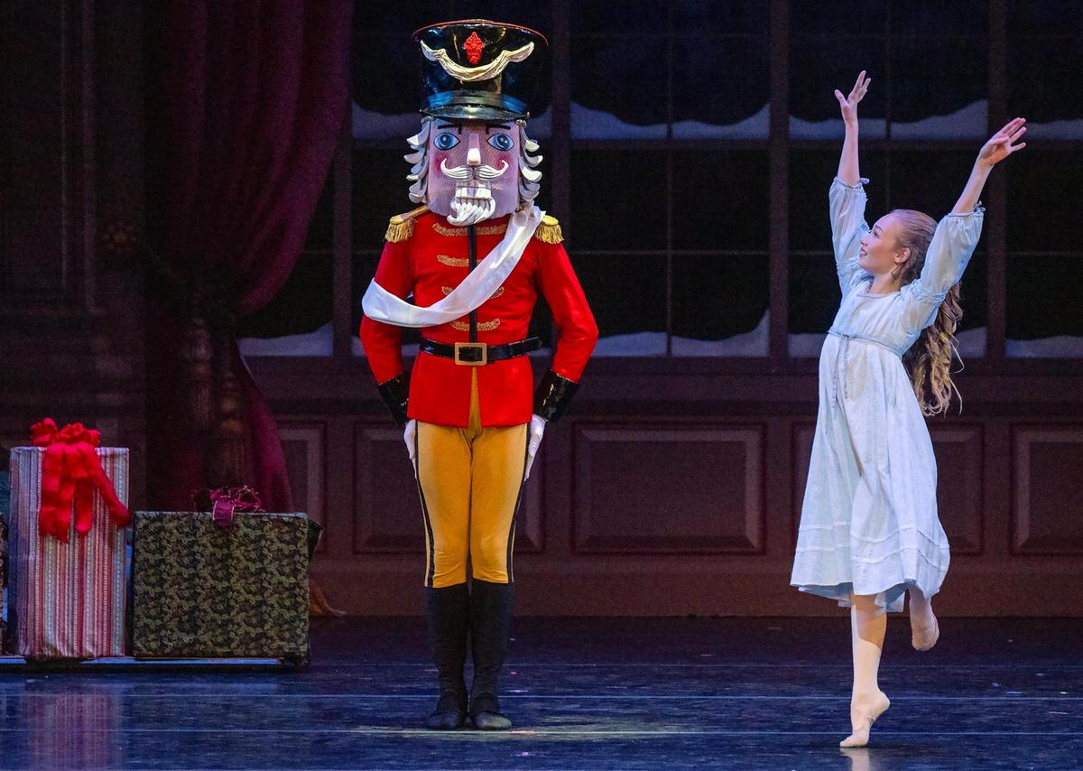 In her role as Clara, Samantha Stortzum dances on stage along side the Nutcracker in the Kansas City Ballet’s final dress rehearsal of “The Nutcracker” at the Kauffman Center for the Performing Arts.