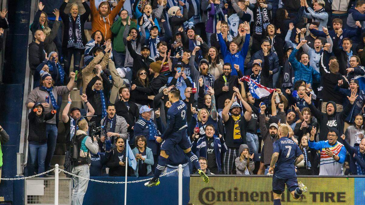Sporting Kansas City forward Alan Pulido (9) celebrates the opening goal in front of the excited cauldron fans during the home opener match between Sporting Kansas City and the Houston Dynamo on Saturday, March 7, 2020 at Children’s Mercy Park in Kansas City, Kansas.
