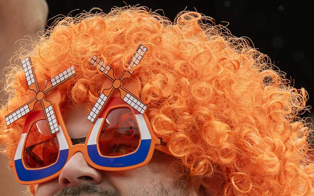 A Netherlands fan wears Dutch windmill-themed sunglasses and an orange wig while attending a FIFA World Cup group-stage soccer match between the Netherlands and Tunisia at Kansas City Stadium on Thursday, June 25, 2026.