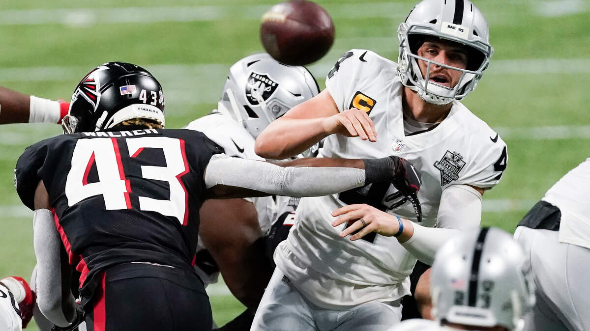 Atlanta Falcons linebacker Mykal Walker (43) hits Las Vegas Raiders quarterback Derek Carr (4) during the second half of an NFL football game, Sunday, Nov. 29, 2020, in Atlanta. Carr through an interception on the play. (AP Photo/John Bazemore)