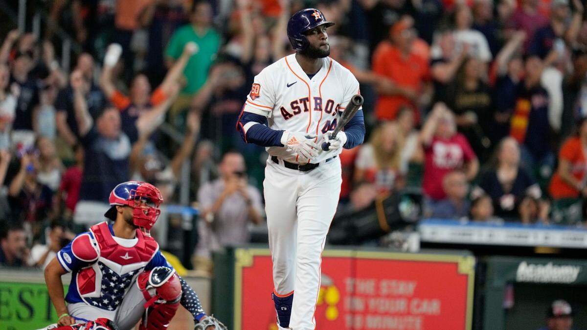 Houston Astros designated hitter Yordan Alvarez, right, watches his walkoff home run during the ninth inning of a baseball game against the Kansas City Royals, Monday, July 4, 2022, in Houston. (AP Photo/Eric Christian Smith)