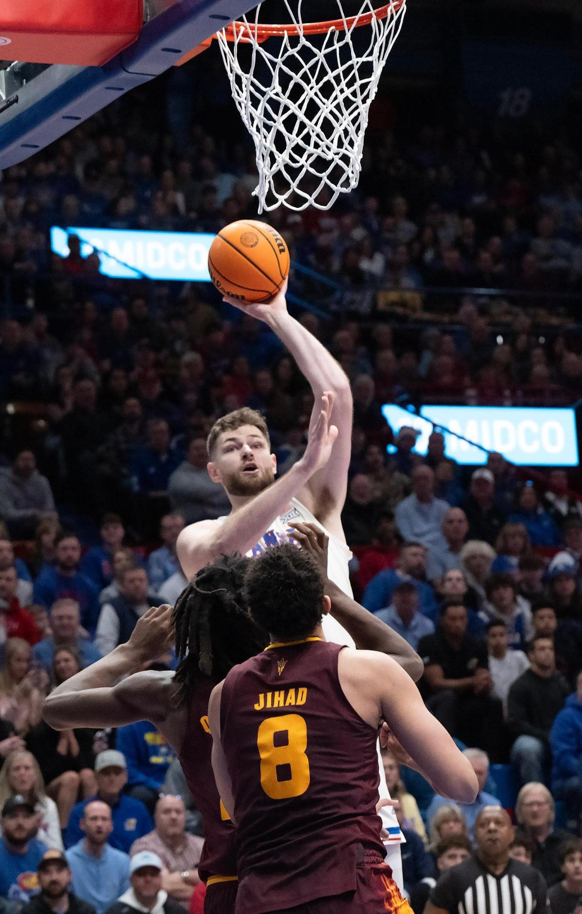 Kansas Jayhawks center Hunter Dickinson rises for a one-handed bucket during a college basketball game against the Arizona State Sun Devils at Allen Fieldhouse on Wednesday, Jan. 8, 2025, in Lawrence, Kansas.