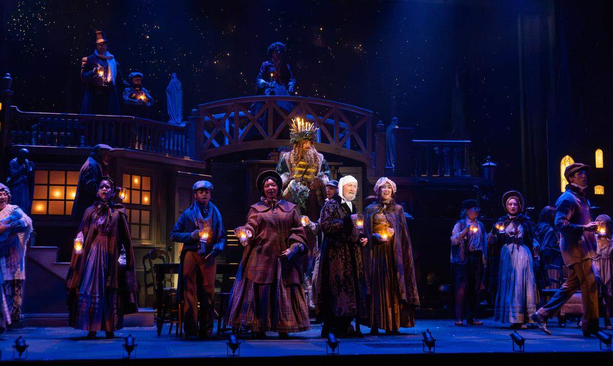 The cast of performs in KC Rep’s 2025 production “A Christmas Carol.” This year marks Gary Neal Johnson’s final time as Ebenezer Scrooge.