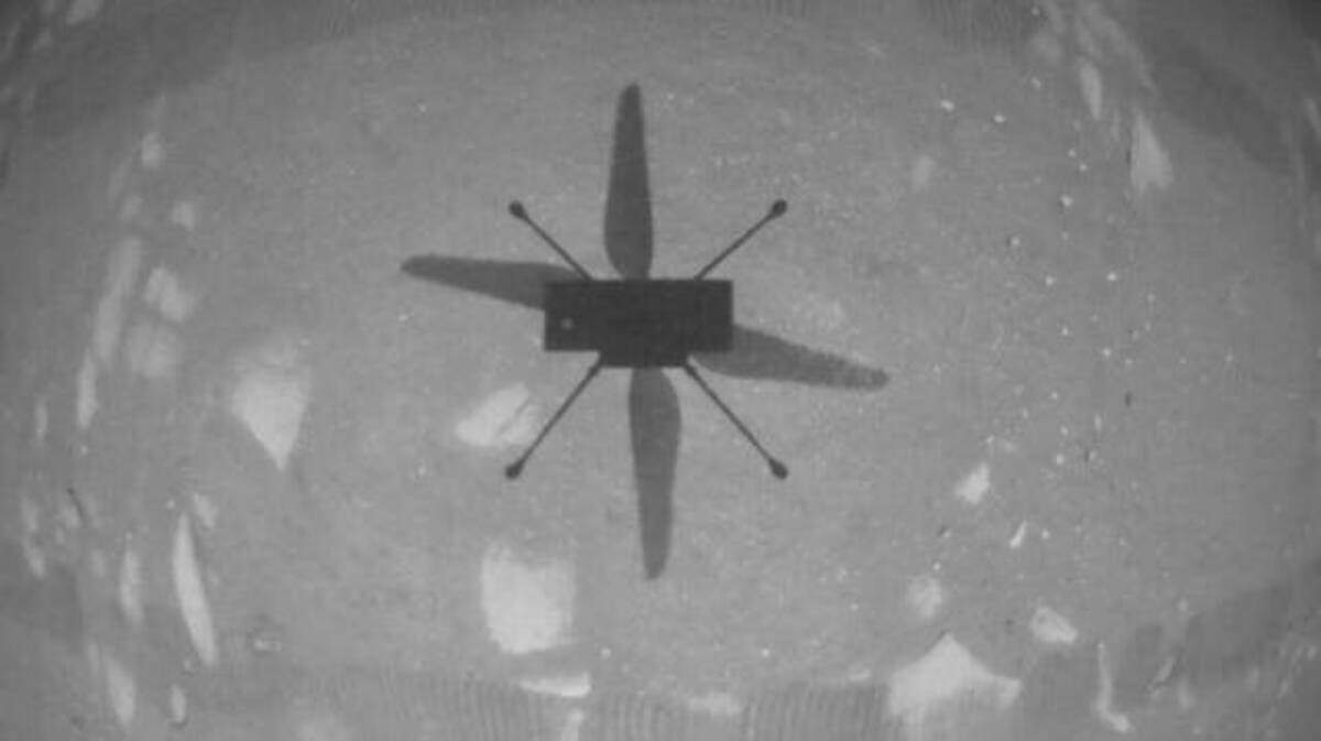 NASA’s Ingenuity Mars Helicopter captured this image as it hovered over the Martian surface on Monday. It marked history as the first instance of powered, controlled flight on another planet.