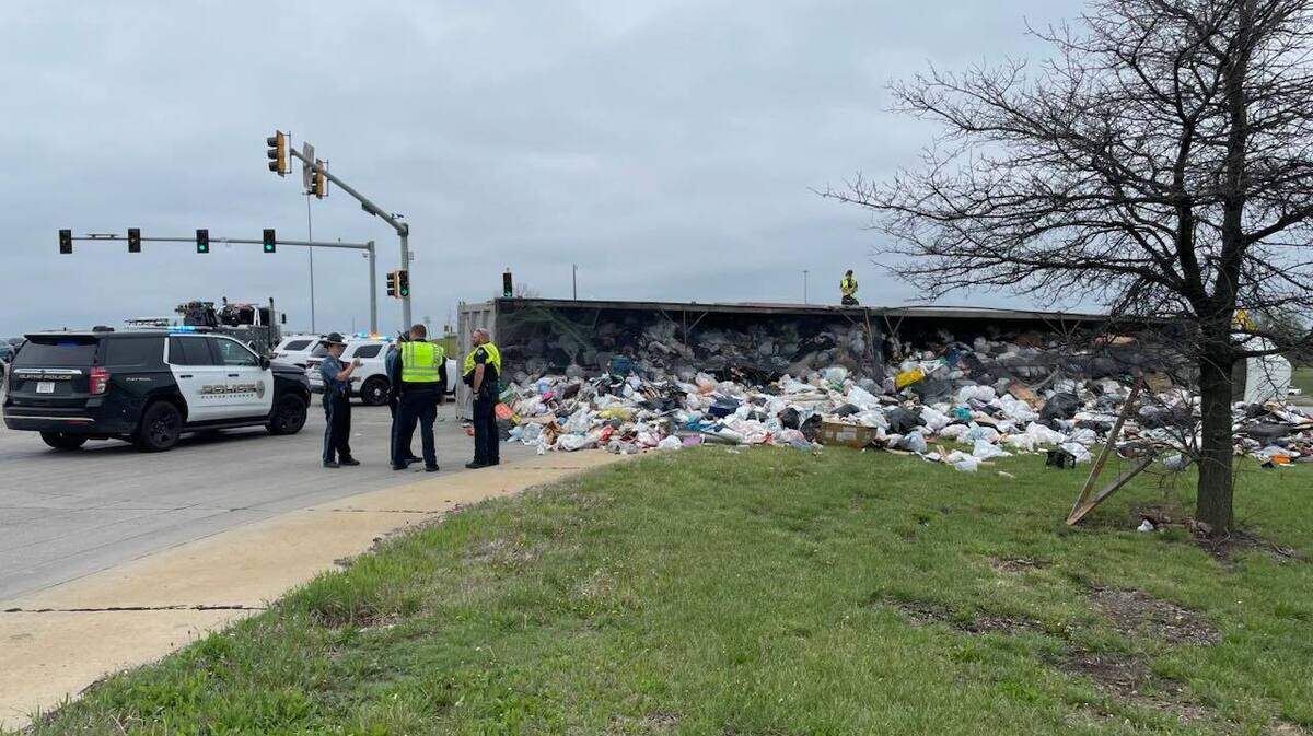 Crews anticipate it will take several hours to clear a wreck after a semi truck hauling trash overturned at 151st Street and I-35 in Olathe.
