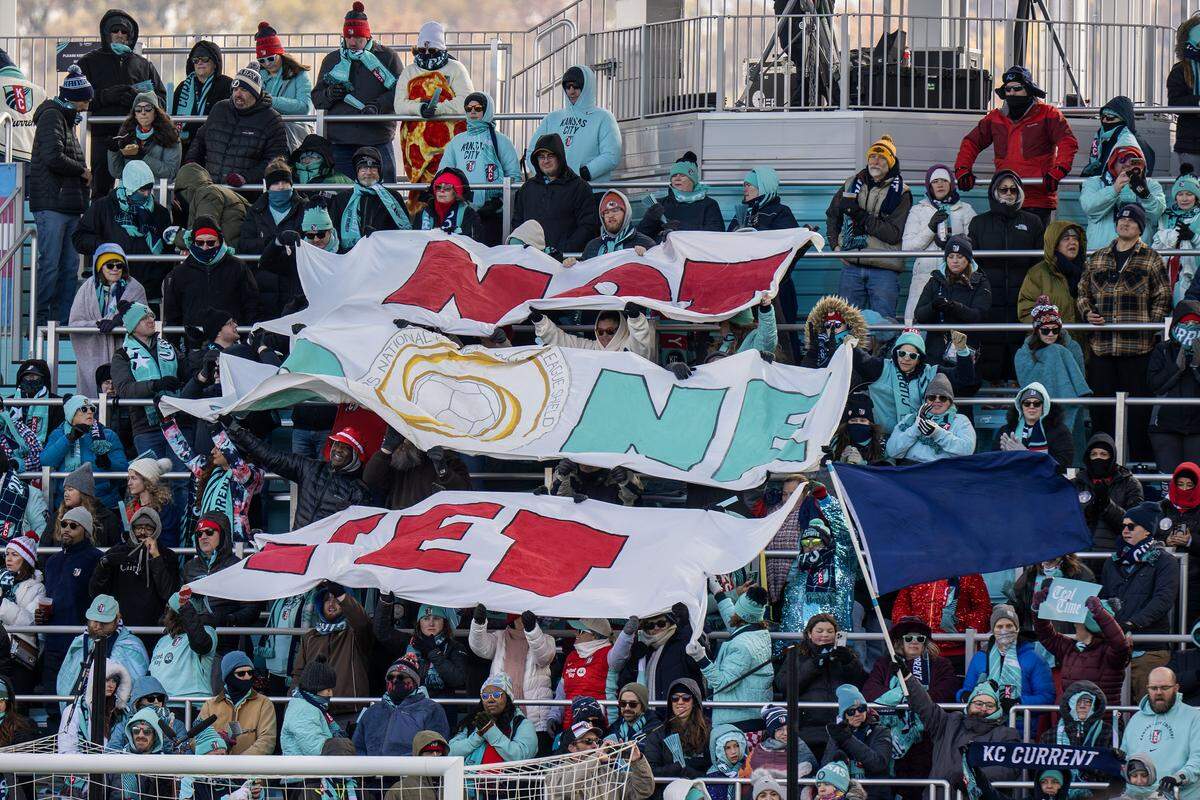 Fans hold a banner reading “Not Done Yet” during extra time against Gotham at an NWSL quarterfinal playoff match inside CPKC Stadium in Kansas City on Sunday, Nov. 9, 2025.