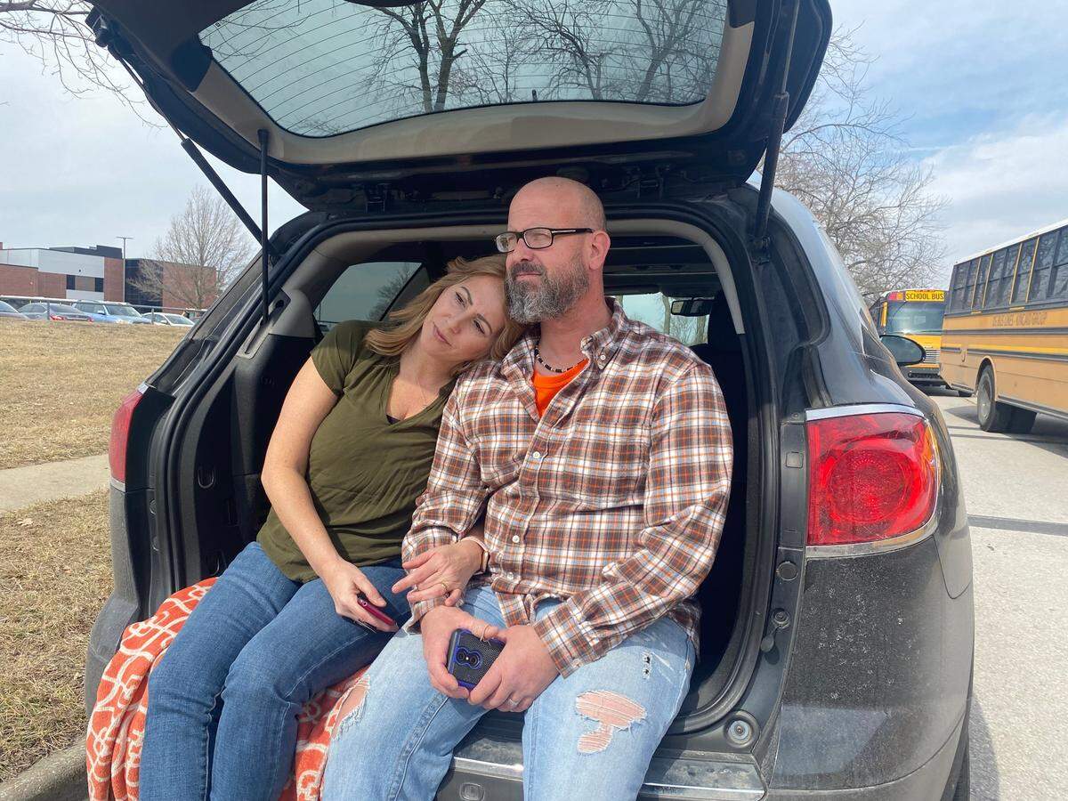 Dustey and Kyle Peterson waited outside Olathe East High School for their son to be released. After arriving at the school, they were stuck in gridlock. 