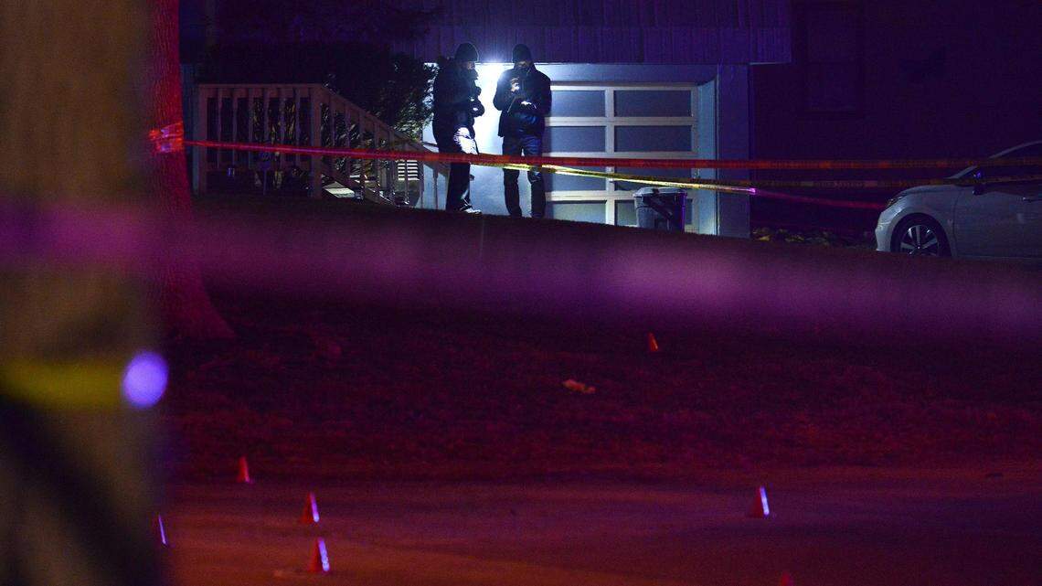 Kansas City police investigate a homicide Sunday, Dec. 13, 2020, in the 9800 block of Cambridge Avenue.