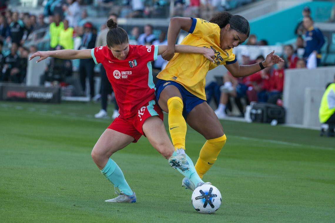 Kansas City Current defender Izzy Rodriguez (18) attempts to steal the ball from a Utah Royals defender, on Saturday, March 14, 2026, at the CPKC Stadium. The Current won 2-1 against the Utah Royals.