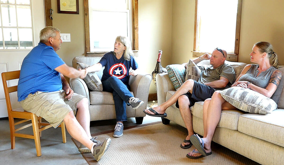 Retired Army medic Chris Wolfenbarger (second right) has been to Hickory Hills Veterans Lodge, built by Orin Jackson (left), a few times. He said he was very excited to be able to share the experience with wife Leah Sword (right) and their family on a recent trip. Wolfenbarger’s mother-in-law, Connie Dukes (second right), who spent 8 years in the Air Force during the Vietnam War, called Jackson one of God’s angels for helping veterans.