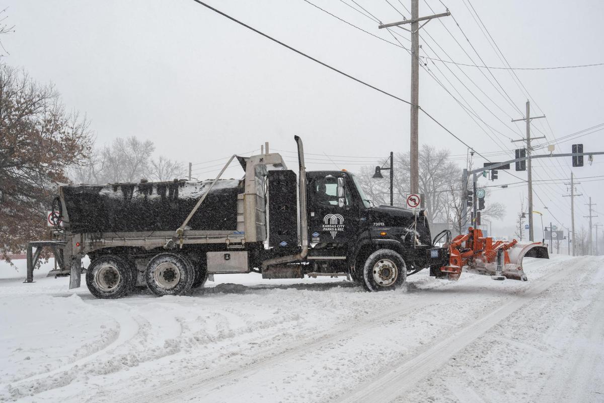 A Kansas City Parks and Recreation snow plow drives down 39th Street in Kansas City on Sunday, Jan. 5, 2025.