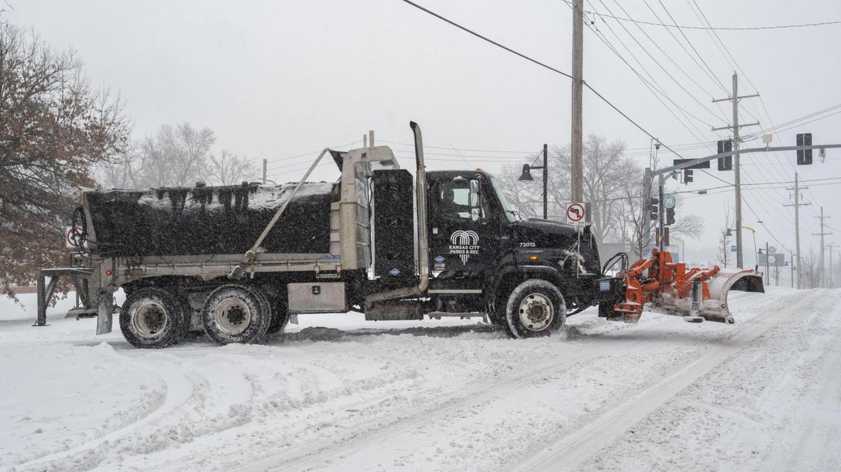 A Kansas City Parks and Recreation snow plow drives down 39th Street in Kansas City on Sunday, Jan. 5, 2024.