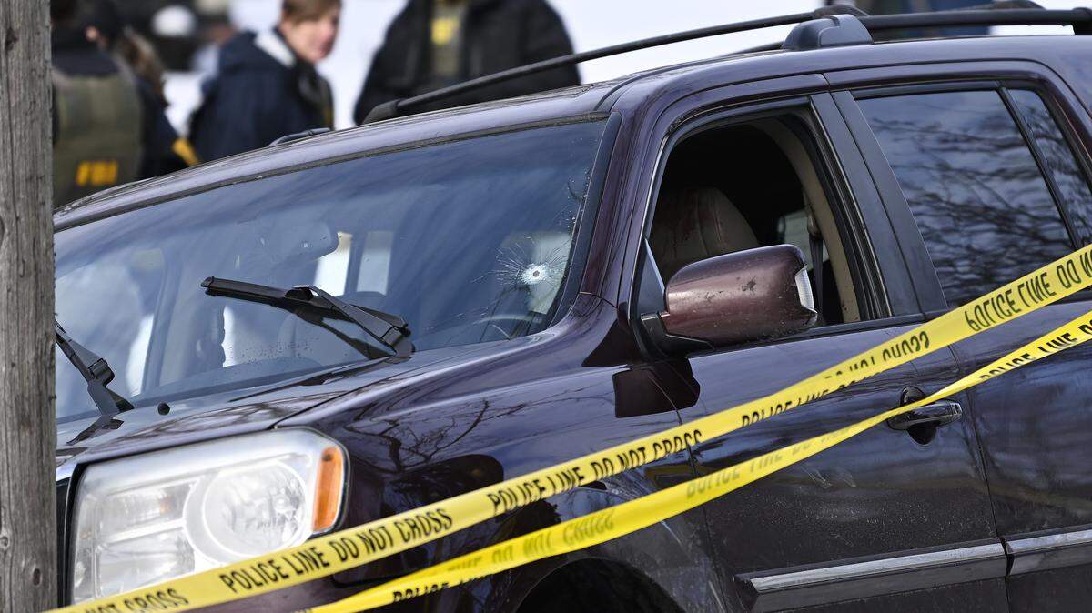 Police tape surrounds a vehicle suspected to be involved in a shooting by an ICE agent during federal law enforcement operations on Jan. 7, 2026 in Minneapolis, Minnesota.