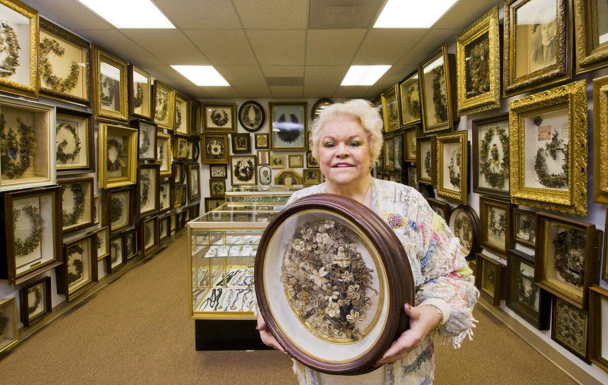 Leila Cohoon poses in 2009, surrounded by her artifacts in her Hair Museum.