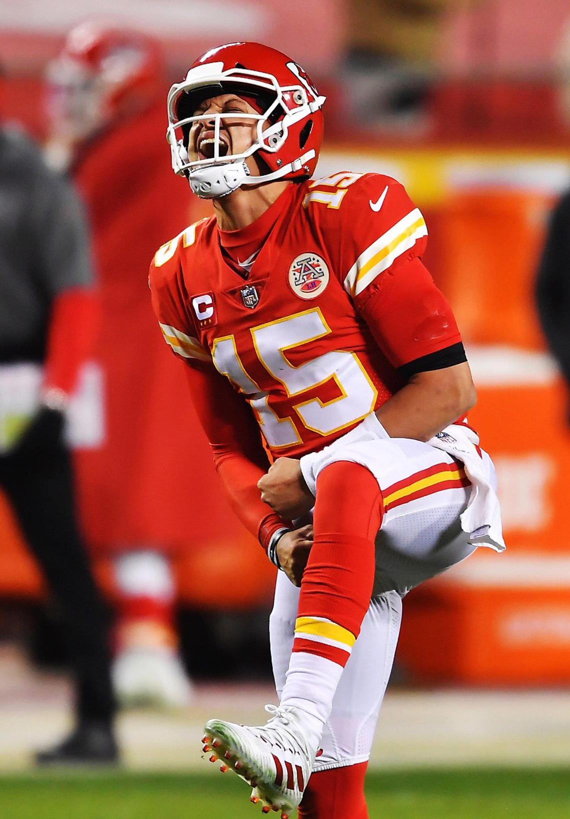 Kansas City Chiefs quarterback Patrick Mahomes celebrates after throwing a touchdown pass to tight end Travis Kelce in the fourth quarter Sunday, January 24, 2021, during the AFC Championship Game at Arrowhead Stadium in Kansas City, Missouri.