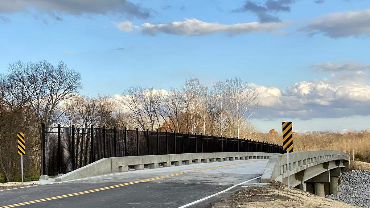The Kenneth Road Bridge will be complete in time for the holidays, connecting the Village of Loch Lloyd with south Johnson County.