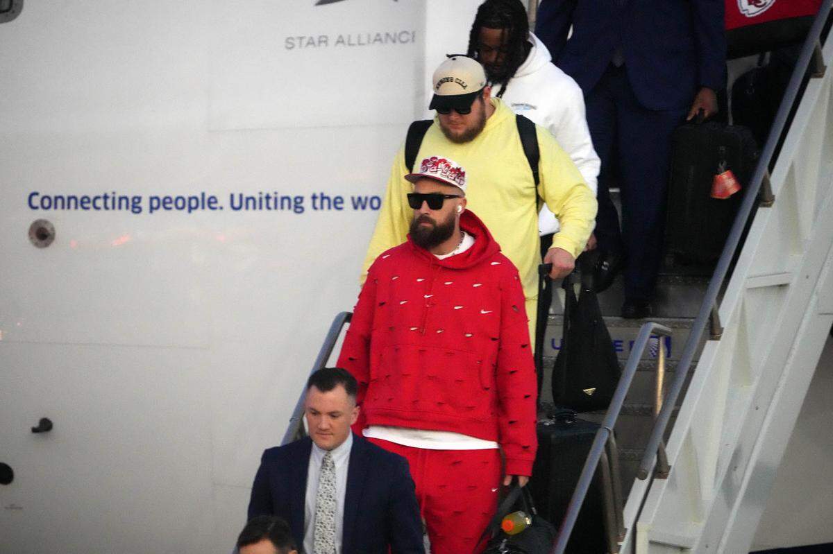 Feb 4, 2024; Las Vegas, NV, USA; Kansas City Chiefs tight end Travis Kelce exits plane during Super Bowl 58 team arrivals at the Harry Reid International Airport.