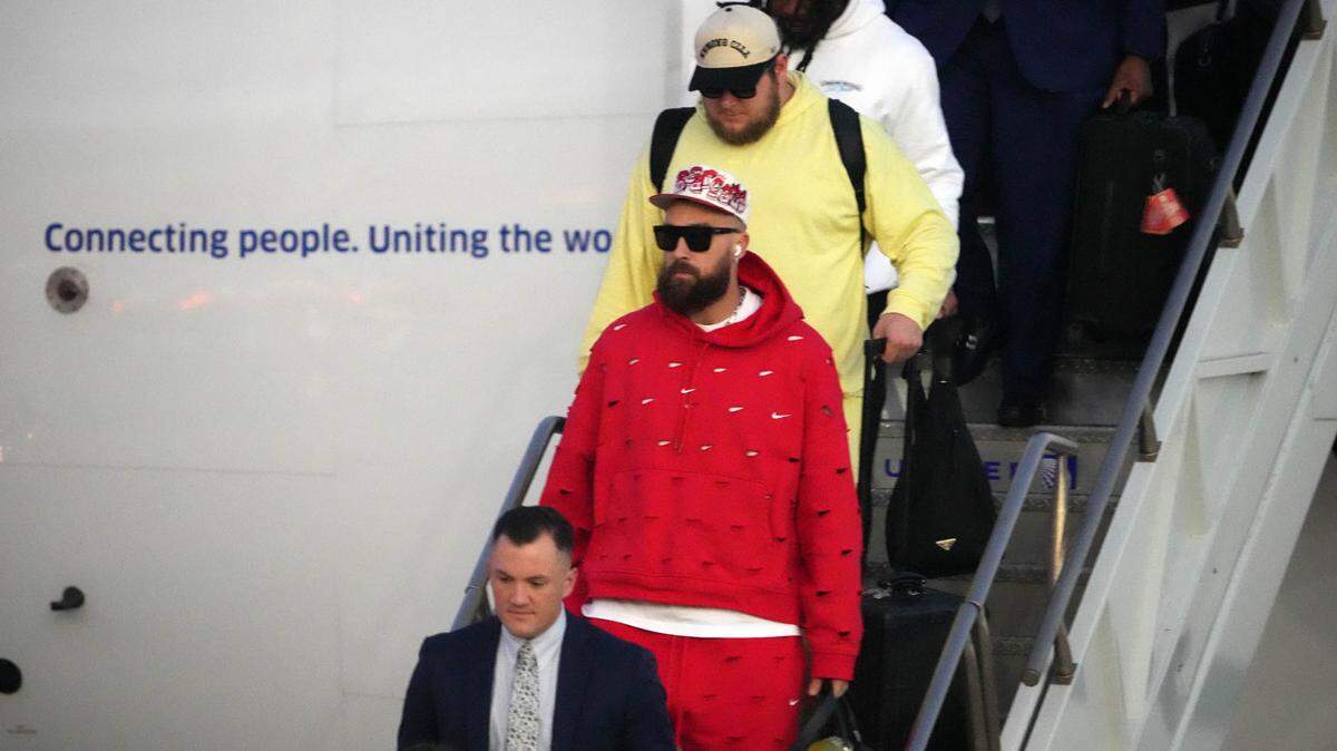 Feb 4, 2024; Las Vegas, NV, USA; Kansas City Chiefs tight end Travis Kelce exits plane during Super Bowl 58 team arrivals at the Harry Reid International Airport.