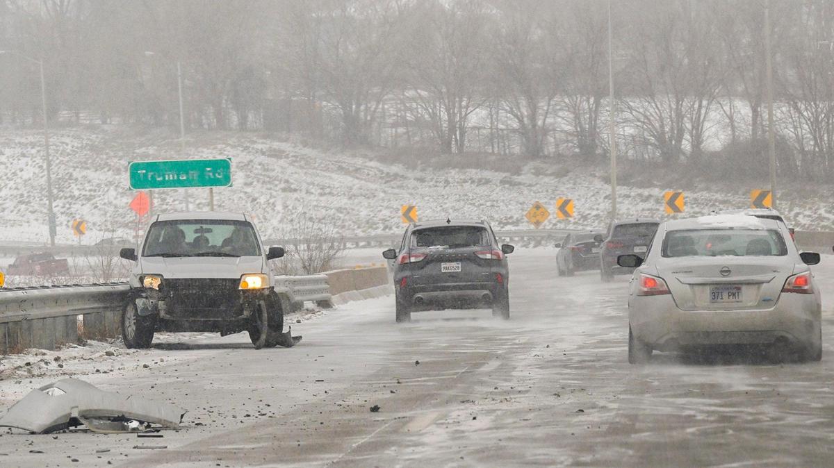 A vehicle was damaged after sliding into a guardrail on Interstate 70 east of downtown Kansas City amid snow fall and frigid temperatures on Monday, Jan. 15, 2024.