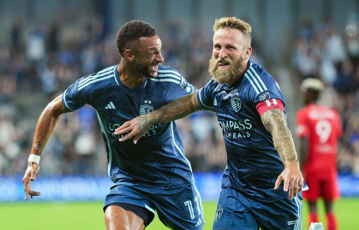Sporting Kansas City forward Johnny Russell (7) celebrates with forward Khiry Shelton (11) after scoring a goal during the first half against Indy Eleven at Children’s Mercy Park on Aug. 27, 2024.