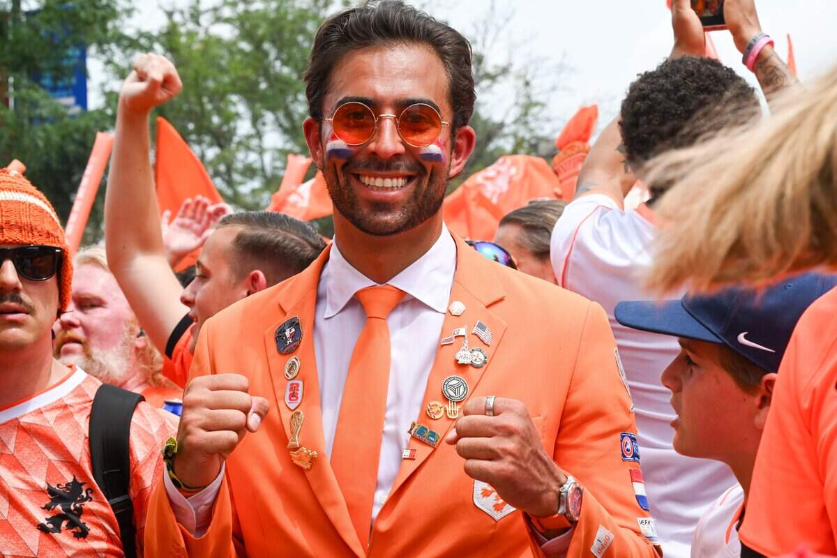 Dutch soccer superfan Daniel Oordt sports his iconic orange suit at the Netherlands Orange Walk from Kansas City's Power & Light District to FIFA Fan Fest on June 25, 2026.