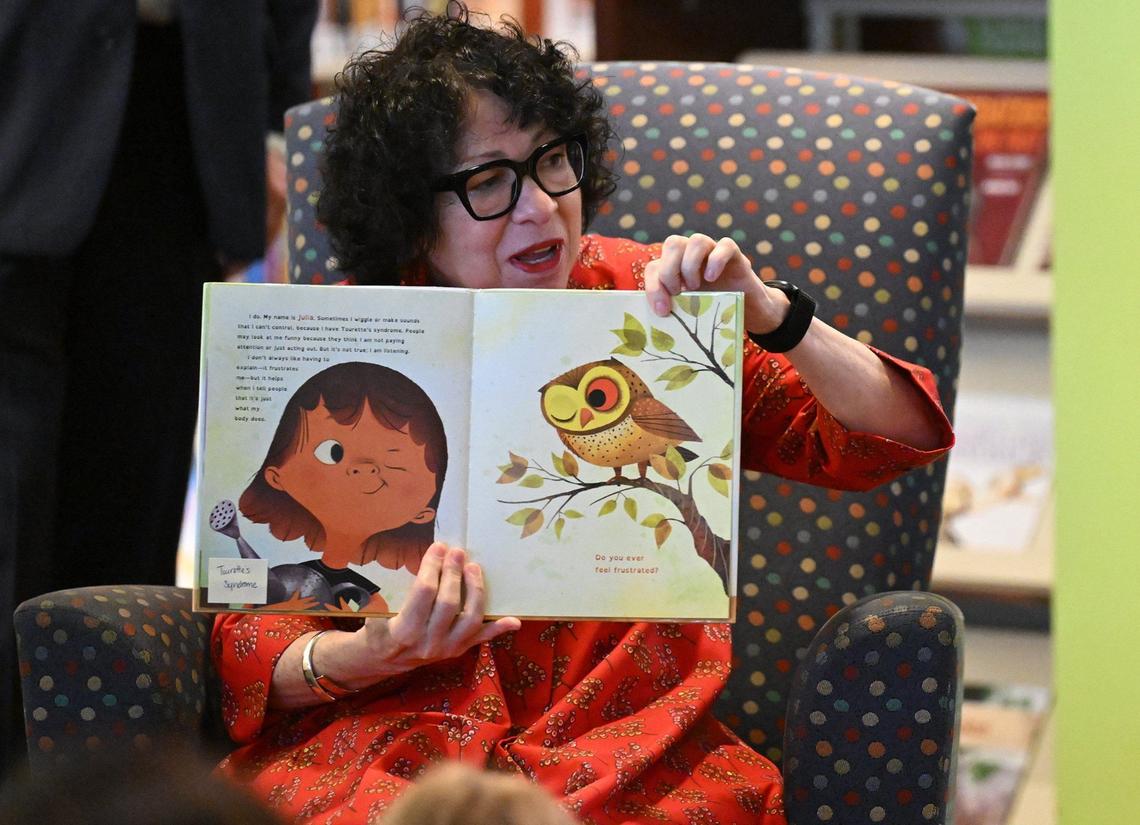 Justice Sotomayor held up her book showing the illustrations by Rafael Lopez as she read out loud to children in Kansas City on Friday.