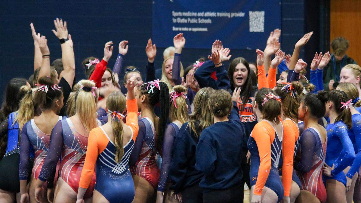 High school gymnasts from across Kansas participate in a chant before the KSHSAA Girls Gymnastics state meet on Oct. 25, 2025 in Olathe.