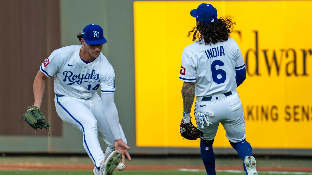 A flyball dropped between Kansas City Royals outfielder Jac Caglianone (14) and third baseman Jonathan India (6) in the second inning of the game against the New York Yankees on Tuesday, June 10, 2025, at Kauffman Stadium in Kansas City.