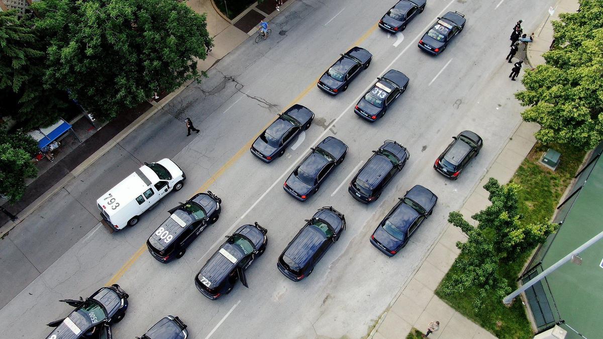 Several hundred people gathered Saturday, May 30, 2020, at the J.C. Nichols Fountain for a second day of protests against police brutality and the death of George Floyd. Additional police arrived and lined up south of where protesters gathered.