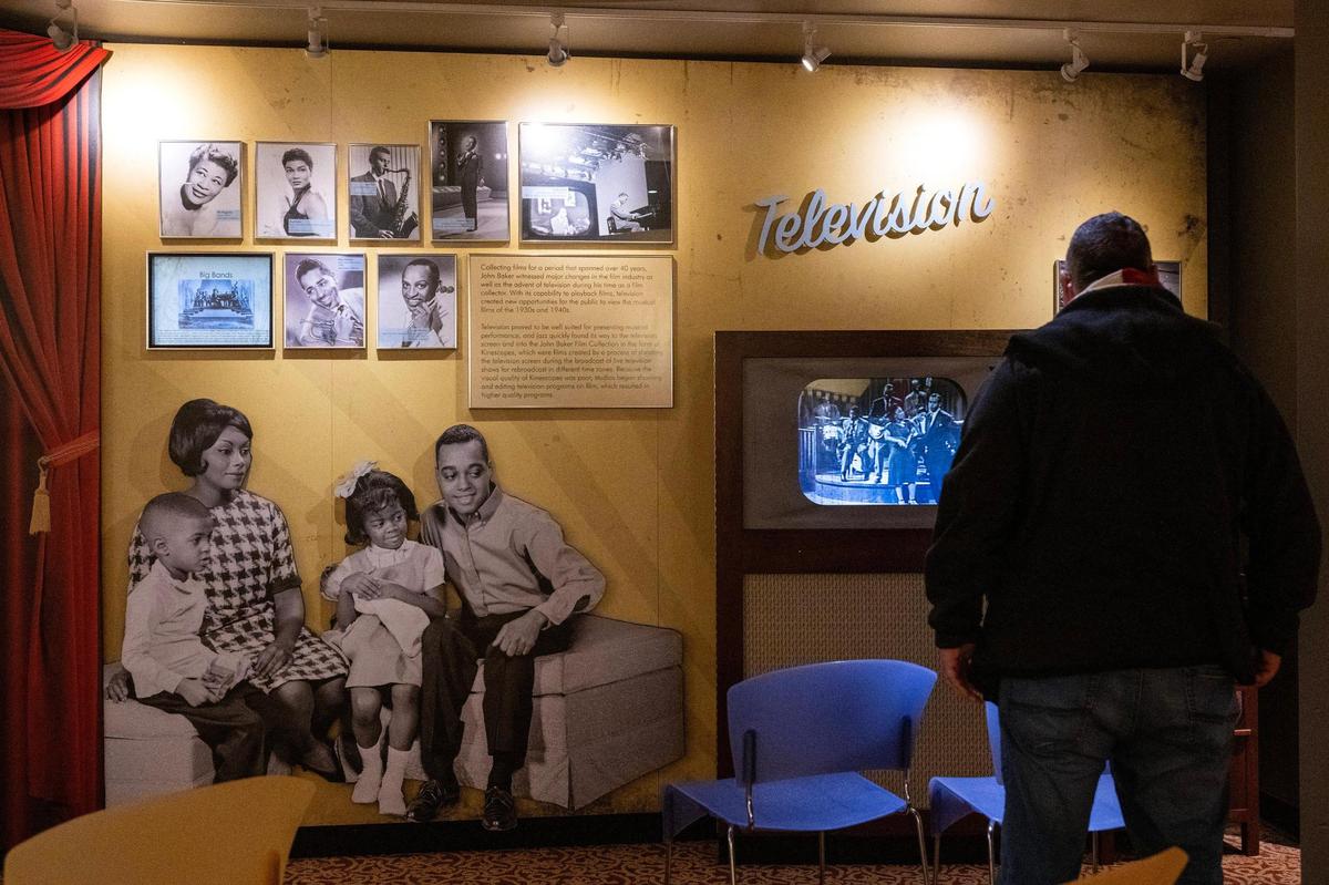 A visitor explores the Baker Film Room at the Jazz Museum on Wednesday, Dec. 18, 2024, in Kansas City.