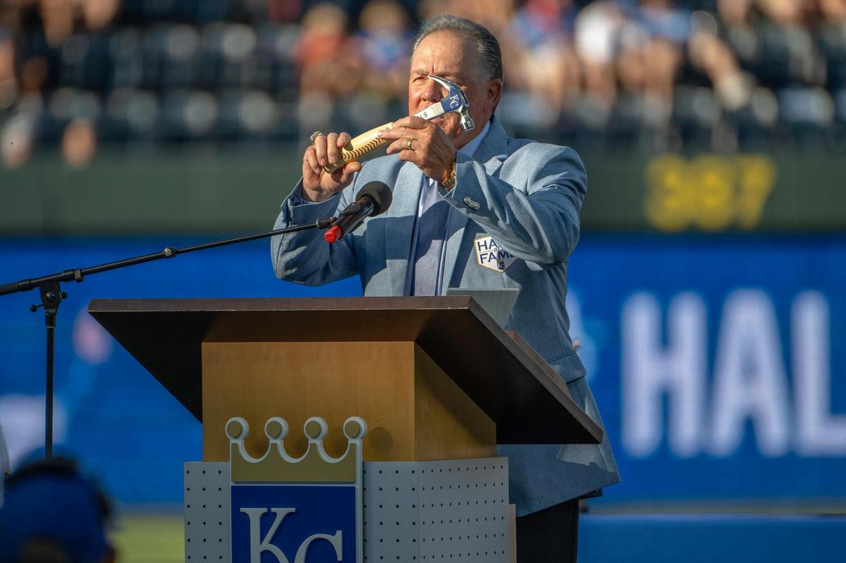 Former Kansas City Royals manager Ned Yost holds a hammer given to him by former general manager Dayton Moore during a Hall of Fame induction ceremony at Kauffman Stadium on Saturday, Sept. 2, 2023, in Kansas City.