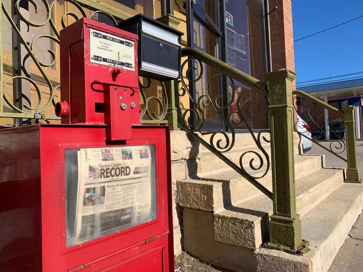 The Marion County Record is displayed in a newspaper box outside the paper’s offices in Marion, Kansas on Monday, Aug. 14, 2023.