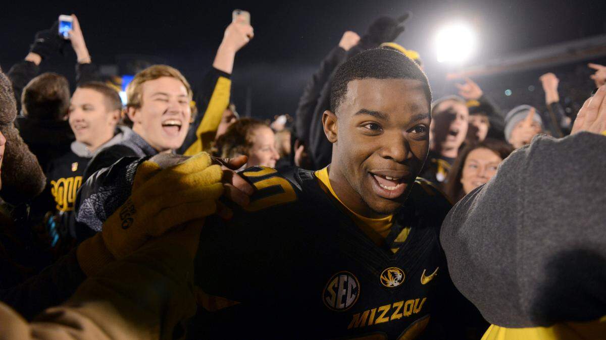 Missouri running back Henry Josey makes his way through the crowd following Missouri’s 28-21 victory over Texas A&M in an NCAA college football game on Saturday, Nov. 30, 2013, in Columbia, Mo. (AP Photo/L.G. Patterson)