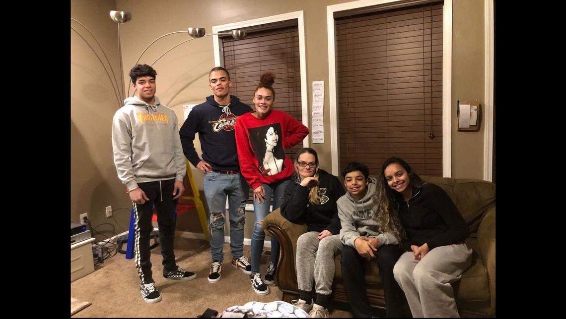 Kane Taddese, last on the left, was a three-sport athlete at Olathe West, where he set and broke several records and participated in orchestra.