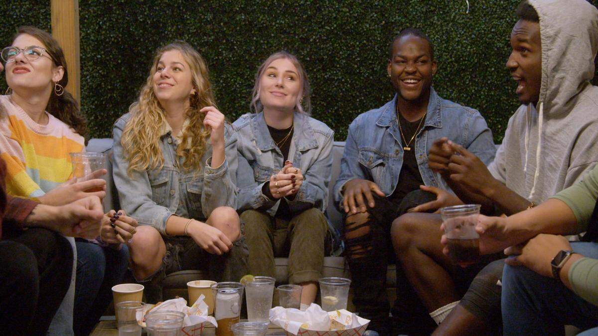 The eight episodes of “Deaf U” follow students at Gallaudet University for a semester, including, from left, Renate Rose of Olathe, Alexa Paulay-Simmons, Cheyenna Clearbrook, Daequan Taylor and Rodney Buford. The makers of the series created a detailed description of this photo to help make it accessible to more people. It has been slightly edited to follow The Star’s guidelines: Renate wears her brown hair back in a ponytail. She is wearing glasses and a multicolor sweater. Alexa has long blond hair, she is wearing a jean jacket and she is smiling. Cheyenna has purple hair pulled back in a ponytail. She is wearing a black shirt, a jean jacket and green pants. She is looking at Rodney. Daequan smiles and wears a black shirt, jean jacket and jeans. Rodney wears a gray hooded sweatshirt while signing.