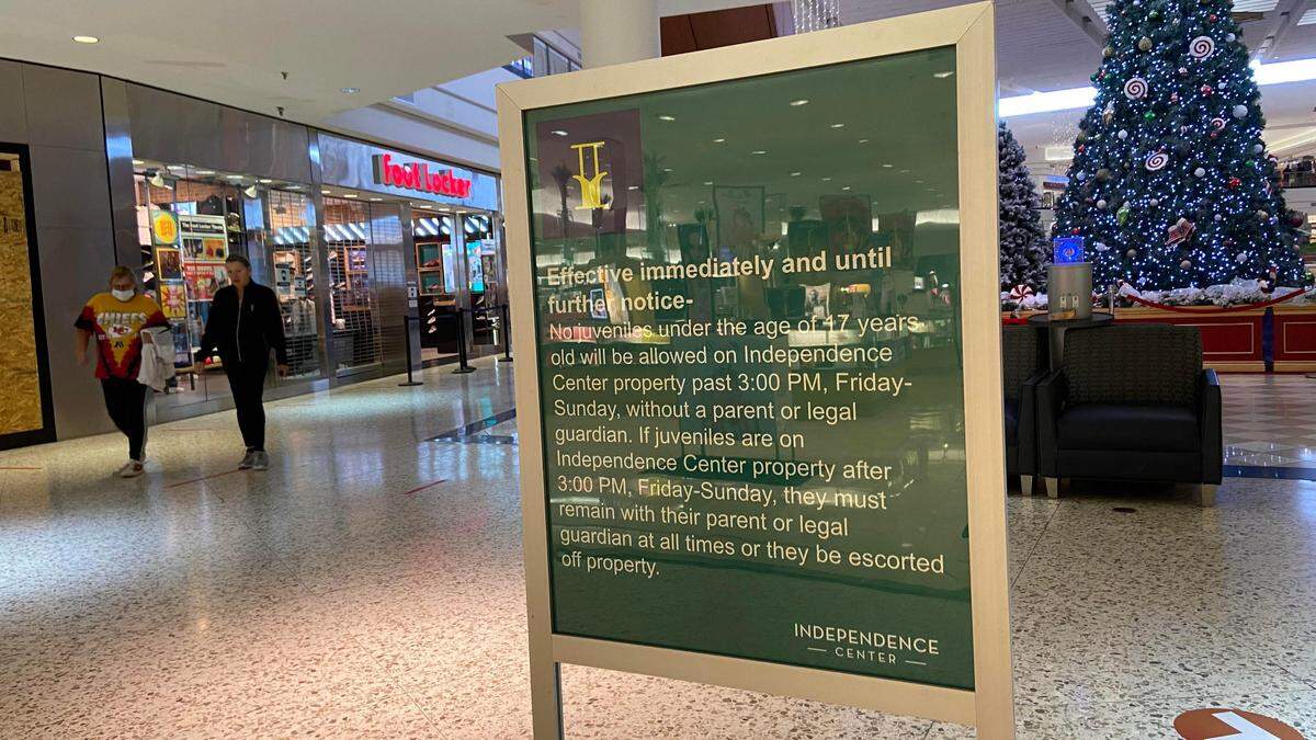 Information regarding new curfew rules, which went into effect Tuesday, is displayed at Independence Center on Tuesday, Jan. 5, 2021. According to the new guidelines, minors are not allowed into the mall without a parent or legal guardian present after 3 p.m.