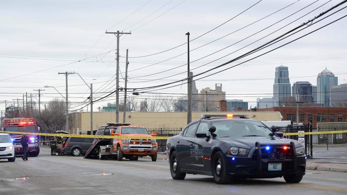 Police investigate a hit-and-run crash Tuesday that killed two people near 18th Street and Brooklyn Avenue in Kansas City.