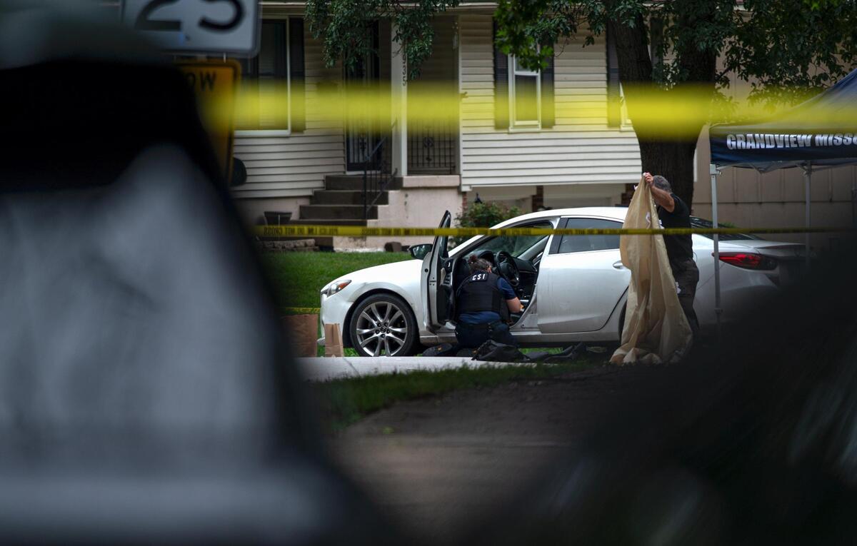 Police clean up the crime scene of a fatal shooting that left one person dead on Wednesday, Aug. 2, 2023, in Grandview. The suspect is accused of shooting two people and killing a third person at three different locations, including two in Kansas City, on Wednesday morning.