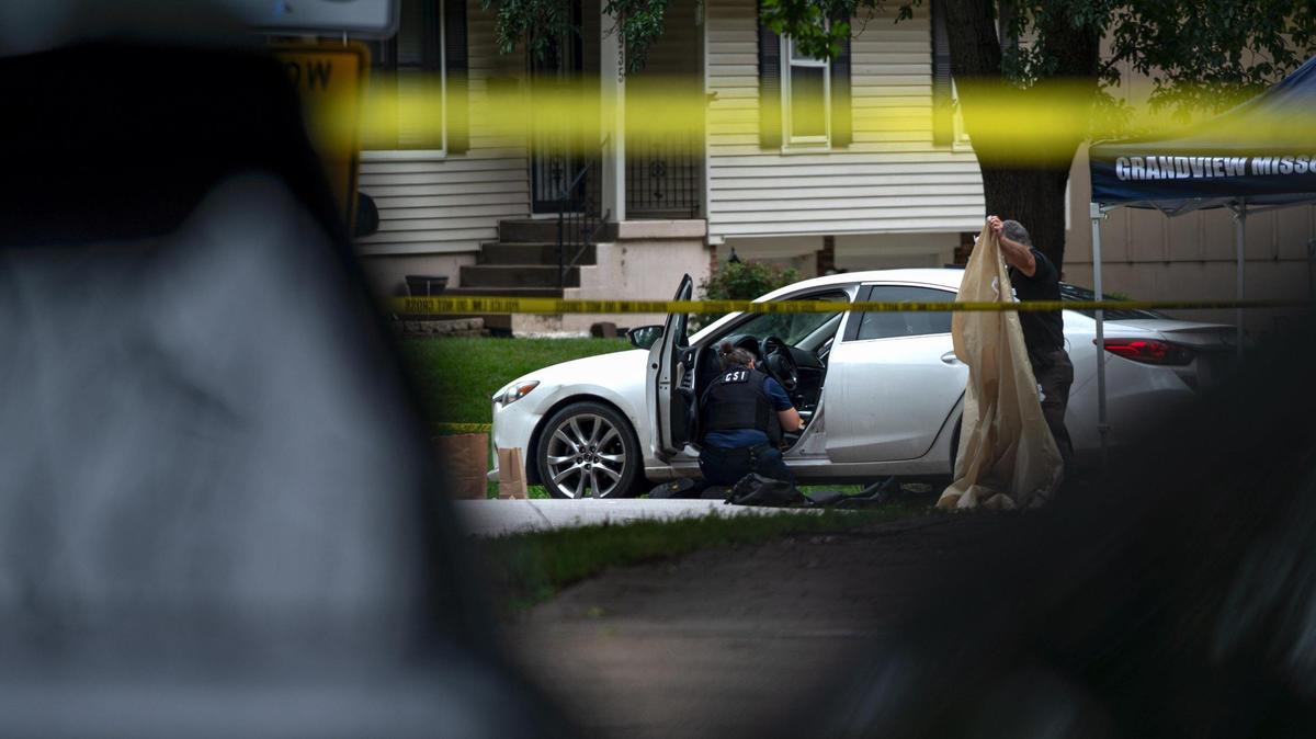 Police clean up the crime scene of a fatal shooting that left one person dead on Wednesday, Aug. 2, 2023, in Grandview. The suspect is accused of shooting two people and killing a third person at three different locations, including two in Kansas City, on Wednesday morning.