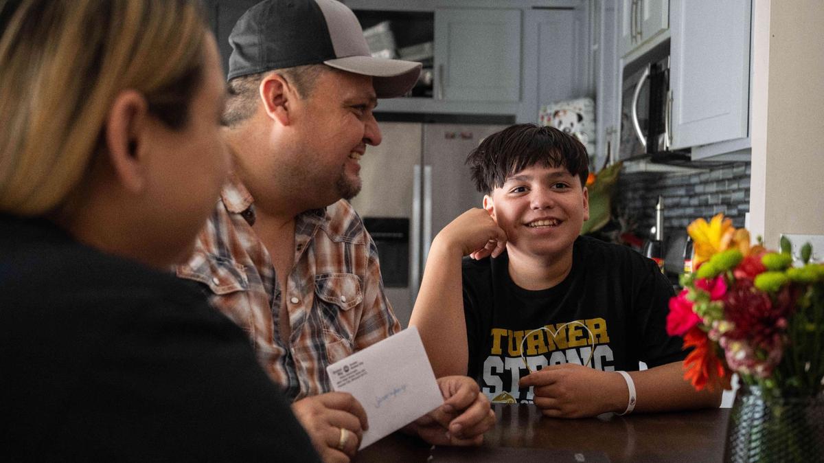 Samuel Arellano and his parents, Antonio and Abigail Arellano, in their home on Aug 28. Samuel was struck by gunfire at the Chiefs Super Bowl celebration at Union Station. Samuel has physically recovered but is still traumatized by the event.