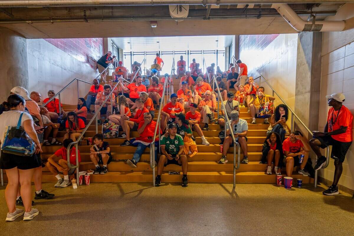 Fans wait for the rain to pass at the Netherlands vs. Tunisia FIFA World Cup group-stage soccer match at Kansas City (Arrowhead) Stadium in Kansas City on Thursday 25, 2026.