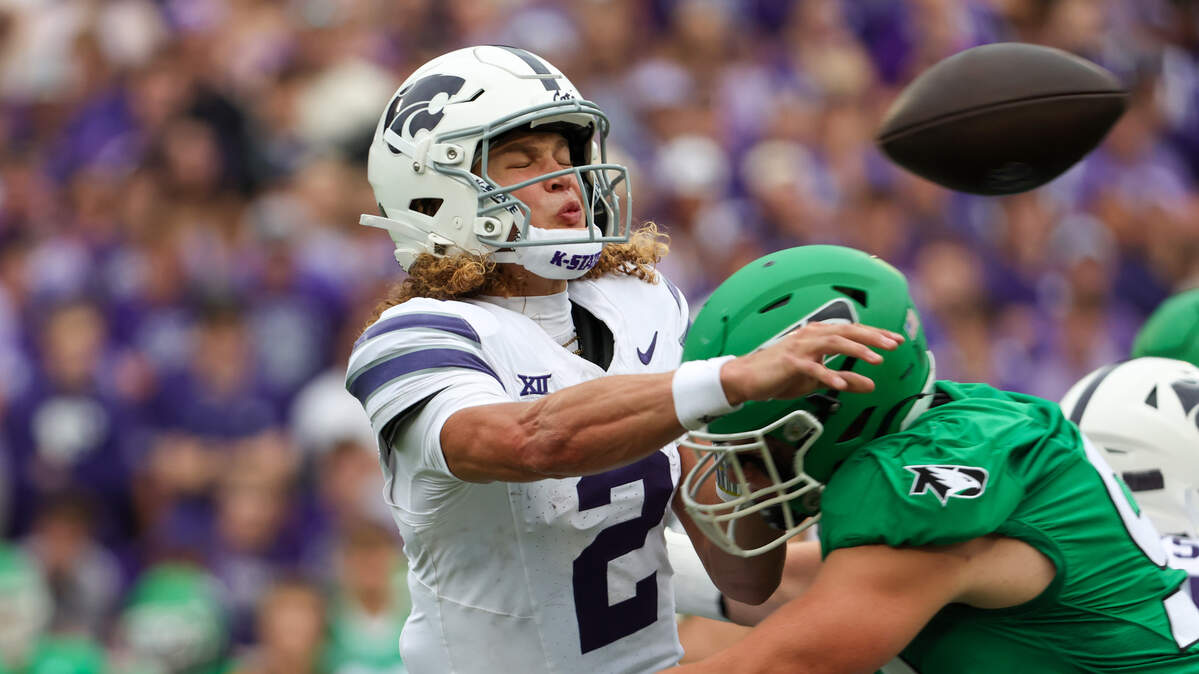 Kansas State Wildcats quarterback Avery Johnson (2) is hit by North Dakota Fighting Hawks edge Grady Kentch (92) as he throws the ball during the first quarter at Bill Snyder Family Football Stadium on Aug. 30, 2025.