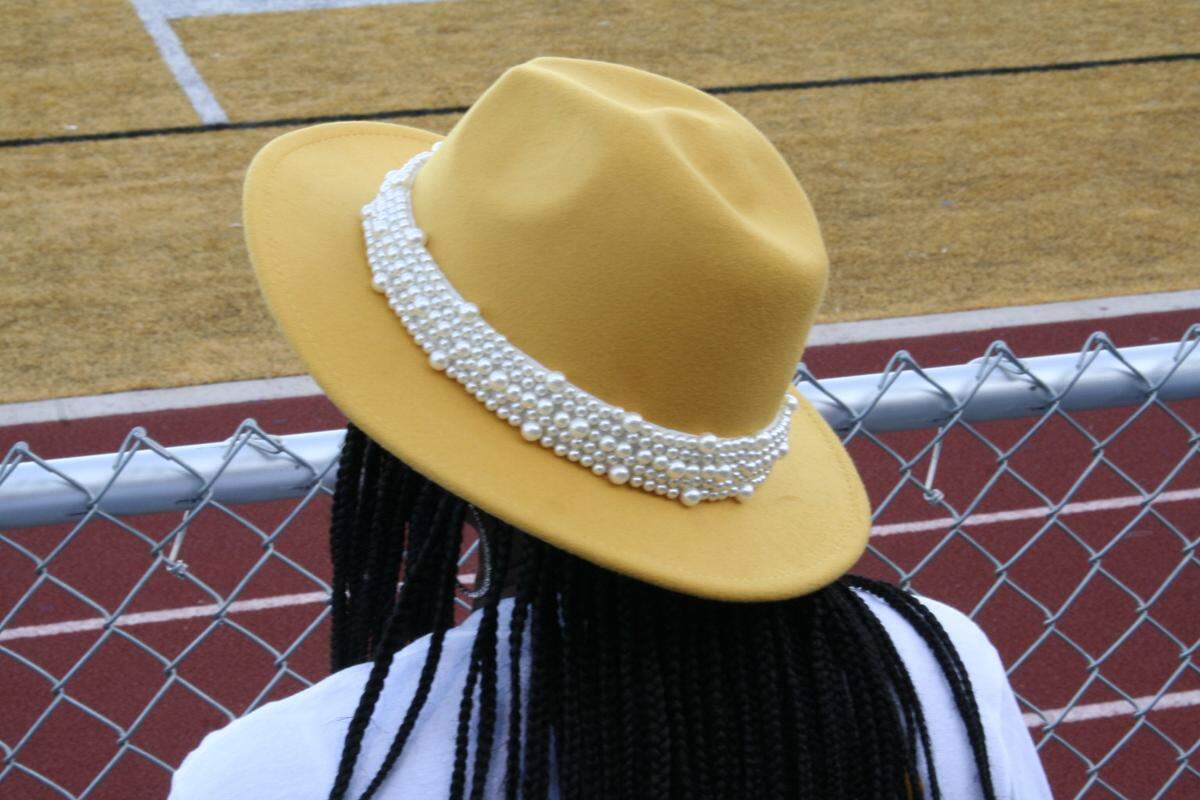 Alumni shows support with school colors for Lincoln College Preparatory Academy at the homecoming game in 2022.