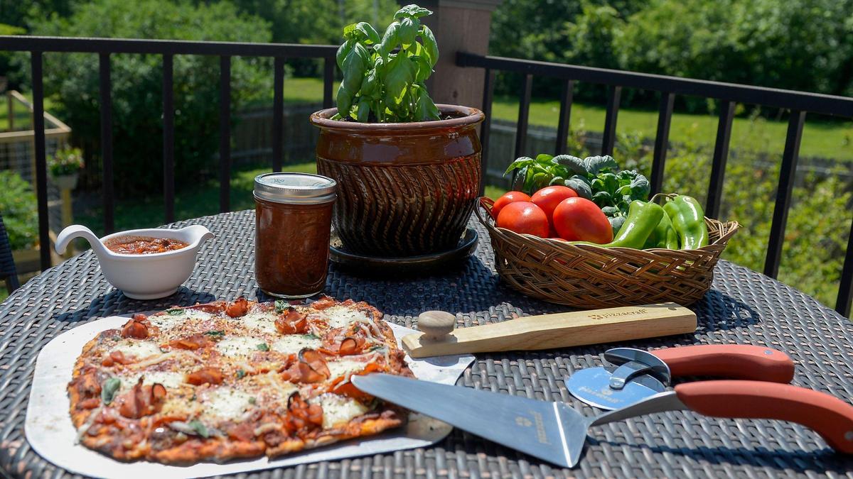 Growing her own herbs and vegetables, including basil, tomatoes and peppers, inspires Sherie Howell to make her own pizza sauce in the summer.