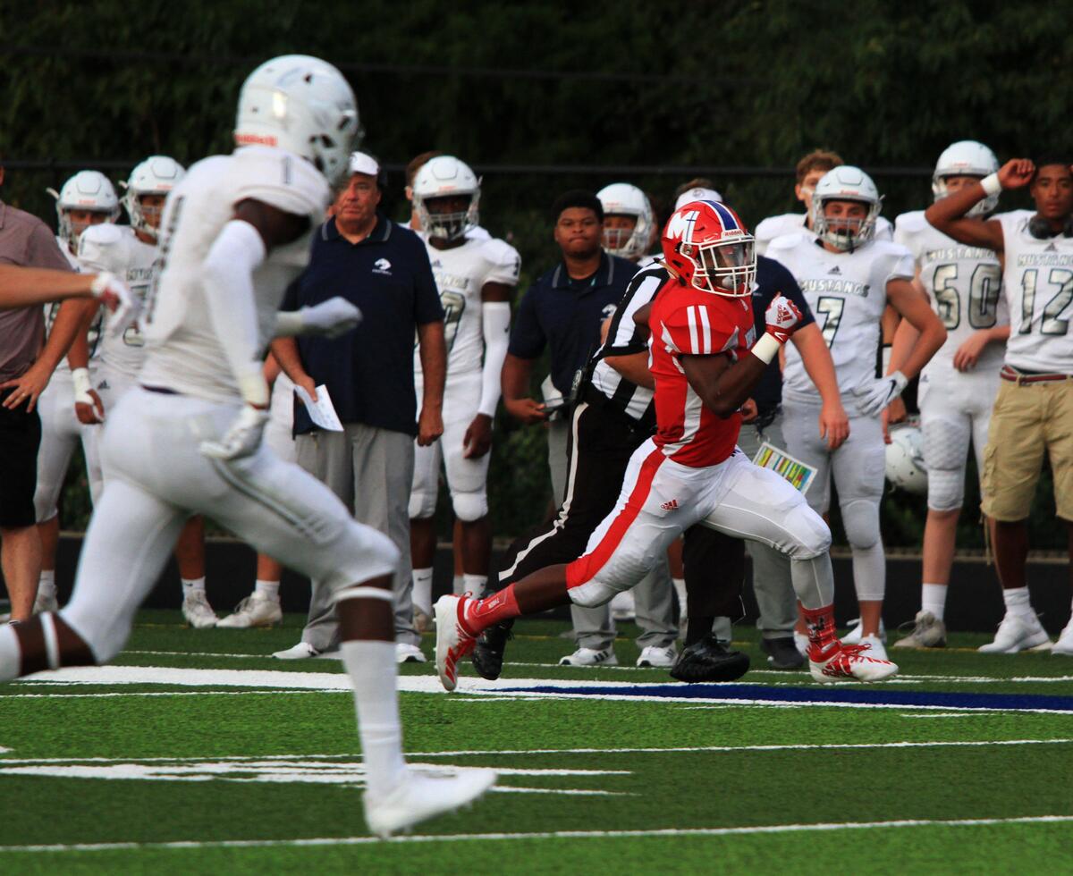 Miege’s Brison Cobbins ran down the sideline for a big gain on Friday night against Blue Valley North at Bishop Miege.