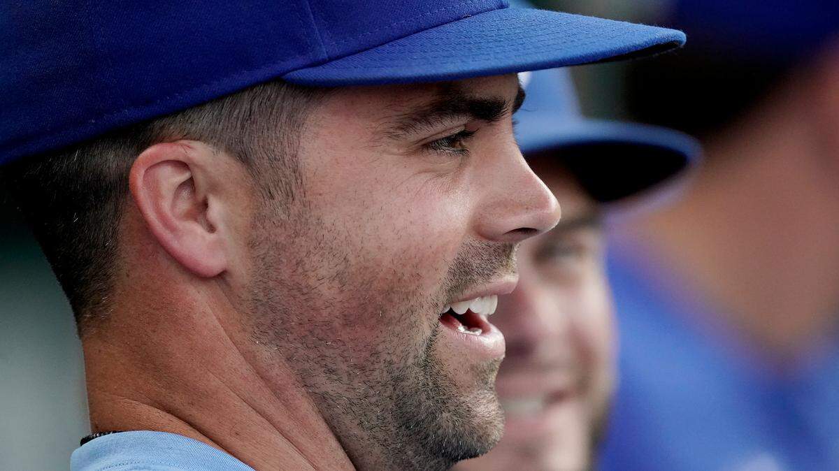 Kansas City Royals’ Whit Merrifield watches from the dugout during the second inning of the second game of a baseball doubleheader against the Detroit Tigers Monday, July 11, 2022, in Kansas City, Mo. Today marked the first day Merrifield has missed playing after setting a Royals record of playing in 533 consecutive games. (AP Photo/Charlie Riedel)